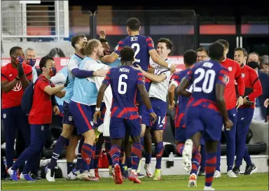  ?? JAY LAPRETE — THE ASSOCIATED PRESS ?? United States’ Sergino Dest (2) celebrates his goal against Costa Rica with teammates during the first half of a World Cup qualifying soccer match, Oct. 13, in Columbus.