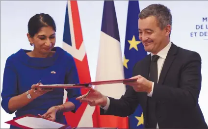  ?? Photo: Nampa/AFP ?? Deal… French interior minister Gerald Darmanin and Britain's home secretary Suella Braverman sign a joint declaratio­n signature in Paris on 14 November 2022.