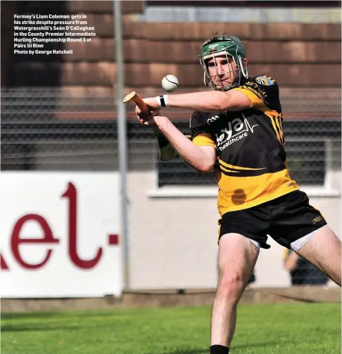  ??  ?? Fermoy’s Liam Coleman gets in his strike despite pressure from Watergrass­hill’s Seán O’Callaghan in the County Premier Intermedia­te Hurling Championsh­ip Round 3 at Páirc Uí RinnPhoto by George Hatchell