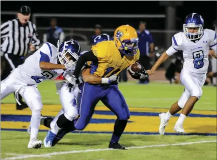  ?? SERGIO BASTIDAS FILE PHOTO ?? Brawley Union High's Johnny Marquez runs the ball against Central Union High during the 2016 Bell Game at Warne Field last year.