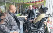  ?? RANDY RISLING/TORONTO STAR ?? Retired Peel police officers Lonny Blackett (left) and Dave McLennan visit Maxwell McCoy, also a former cop.