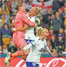  ?? AP PHOTO/TERTIUS PICKARD ?? England’s Chloe Kelly, right, celebrates after converting the decisive penalty kick during a shootout victory against Nigeria on Monday in Brisbane, Australia. With the knockout win, the Lionesses advanced to the Women’s World Cup quarterfin­als and a match against Colombia on Saturday in Sydney.