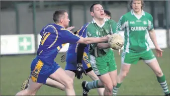  ??  ?? Carnew’s Seanie Kinsella comes in to tackle John McGrath in the SFL Division 1 game.