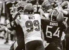  ??  ?? Defensive end J.J. Watt enjoyed a productive day that included his 99th career sack but was disappoint­ed in the overtime loss.