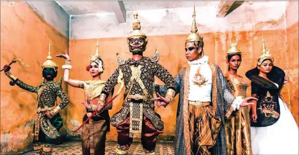  ?? LU GI ?? Khmer artists perform wearing Oliva Kong’s contempora­ry Khmer costumes inspired by the masked dance drama called