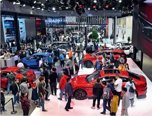  ??  ?? At the 2020 Beijing Internatio­nal Automotive Exhibition, China’s car maker BYD showcases its electric cars and blade battery technology.