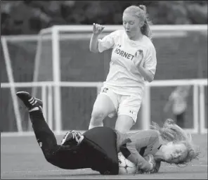  ?? Special to the NWA Democrat-Gazette/DAVID J. BEACH ?? Fayettevil­le goal keeper Gracie Cape (bottom) covers the ball in front of Bryant’s Caroline Campbell during Saturday’s Class 7A girls soccer championsh­ip game at Razorback Field in Fayettevil­le.