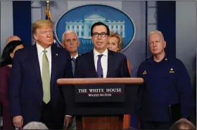  ?? (AP/Evan Vucci) ?? “We’re looking at sending checks to Americans immediatel­y,” Treasury Secretary Steven Mnuchin (center) said Tuesday. “And I mean now, in the next two weeks.”