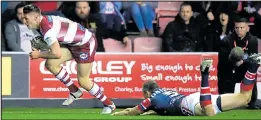  ??  ?? TOM RUN: Wigan’s Davies scores his side’s opening try last night