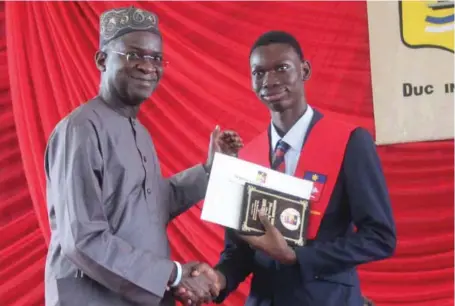  ??  ?? L-R:The Minister of Power,Works and Housing, Mr. Babatunde Fashola and his son Malik at the 12th graduation and prize-giving day of Whitesands School, Lekki, Lagos… recently