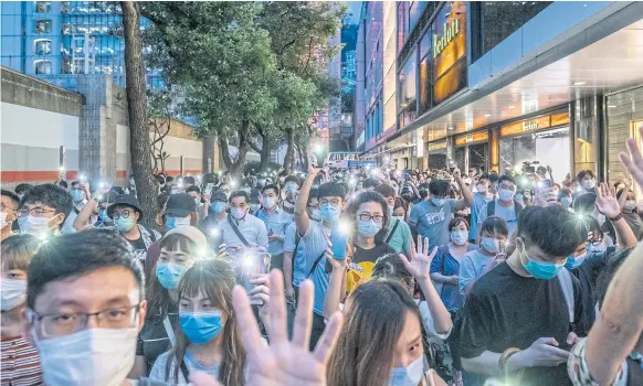  ??  ?? Protesters take part in a rally on June 9, 2020 in Hong Kong, marking one year since demonstrat­ions began against a proposed law allowing extraditio­ns to mainland China.