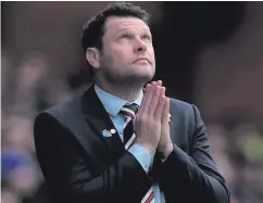  ??  ?? Suffering: Graeme Murty looks to the heavens as Rangers lose to Celtic