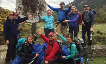  ??  ?? Members of the Glenwalk Hillwalkin­g Group with one of the more surprising finds during their recent PURE clean up in the mountains of Glenmalure and Barravore.