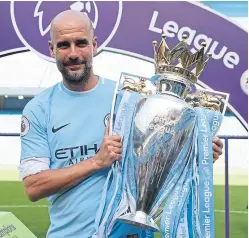  ?? Picture: PA. ?? Manchester City manager Pep Guardiola with the Premier League trophy.