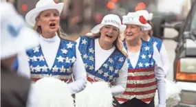  ?? KENNY YOO/AP FILE ?? Debbie Bigler, left Colleen Minisce and Janis Kramer march with the the Milwaukee Dancing Grannies on Nov. 5 in Milwaukee. Bigler and Minisce are among a crop of newer members who are helping the Grannies rebuild after members were killed last year when an SUV plowed through a parade crowd in Waukesha, Wis.