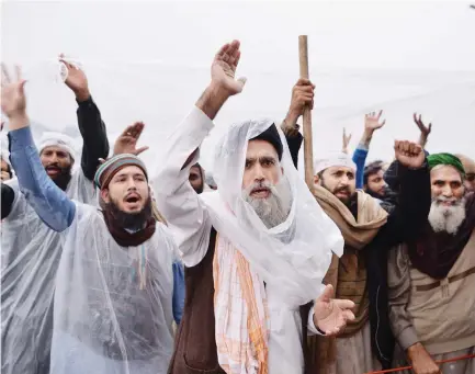  ??  ?? Pakistani activists of a religious group shout slogans during a week long protest in Islamabad on Tuesday. (AFP)