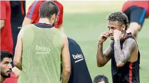  ??  ?? Pleased as punch: Barcelona’s Neymar (right) pretending to box with teammate Gerard Pique after a training session in New Jersey on July 19. — AP