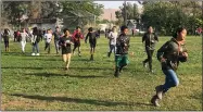  ?? RECORDER PHOTO BY JUAN AVILA ?? Wednesday morning, sixth grade students ran along the track at Los Robles Elementary for, “Run with the Wolves,” jog-a-thon as part of Red Ribbon Week and fundraiser.