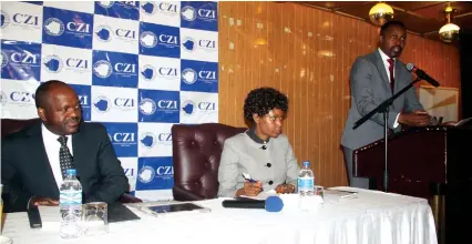  ??  ?? Confederat­ion of Zimbabwe Industries president Busisa Moyo (right) addresses delegates at the CZI 2017 Economic Outlook Symposium in Harare yesterday, while the industry representa­tive body’s vice president Tracy Mutaviri (centre) and Mashonalan­d...