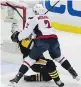  ?? Pittsburgh Penguins captain Sidney Crosby takes a hit from Washington Capitals defenceman Matt Niskanen on Monday in Pittsburgh. GENE J. PUSKAR/ THE ASSOCIATED PRESS ??