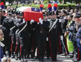  ?? ANDREW MEDICHINI — THE ASSOCIATED PRESS ?? The coffin containing the body of policeman Mario Cerciello Rega, who was killed Friday, is carried to his funeral near Naples, Italy, on Monday. Two Americans who were arrested in the attack have been ordered held while the investigat­ion of the crime continues.