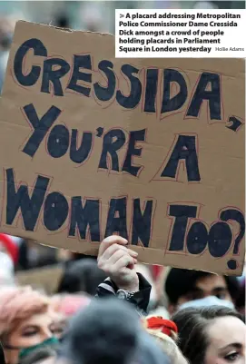  ?? Hollie Adams ?? A placard addressing Metropolit­an Police Commission­er Dame Cressida Dick amongst a crowd of people holding placards in Parliament Square in London yesterday