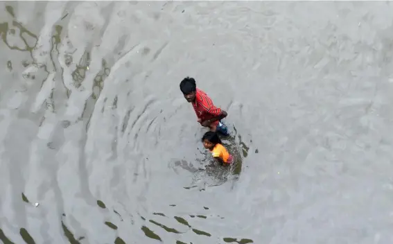  ?? (Getty) ?? Heavy rains have caused flooding in parts of the Sri Lankan capital Colombo