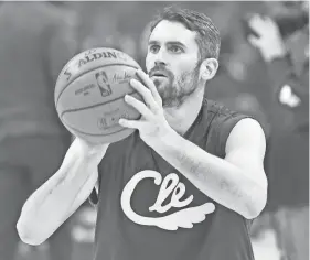  ?? DAVID RICHARD/USA TODAY SPORTS ?? Cavaliers forward Kevin Love warms up before a game against the Pistons on Jan. 7. The Cavaliers reopened practice facilities Friday.