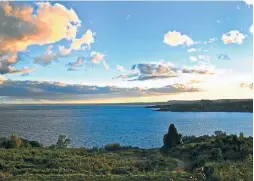  ?? ALL PHOTOS: WAYNE BERNHARDSO­N ?? Sunset over Lago Ranco, viewed from accommodat­ion at Futrono.
