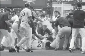  ?? GREGORY SHAMUS, GETTY IMAGES ?? Miguel Cabrera lays on the ground during a bench-clearing brawl with players from American League baseball rival the New York Yankees in Detroit on Thursday night.