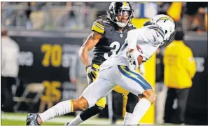  ?? [DON WRIGHT/THE ASSOCIATED PRESS] ?? Chargers wide receiver Keenan Allen (13) gets past Steelers strong safety Terrell Edmunds (34) after making a catch to take it in for a touchdown Sunday in Pittsburgh.