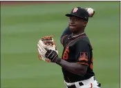  ?? ASHLEY LANDIS — THE ASSOCIATED PRESS ?? San Francisco Giants shortstop Marco Luciano throws to first during a spring training game Friday against the Colorado Rockies in Scottsdale, Ariz.