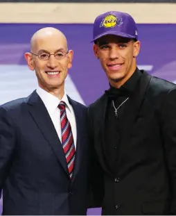  ?? (Reuters) ?? NO. 2 OVERALL pick Lonzo Ball is introduced by NBA commission­er Adam Silver as a selection of the Los Angeles Lakers in the first round of Thursday’s NBA Draft at Barclays Center in Brooklyn.