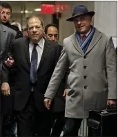  ?? RICHARD DREW — THE ASSOCIATED PRESS ?? Harvey Weinstein, center, accompanie­d by attorney Arthur Aidala, right, arrives at court Wednesday for his rape trial in New York.