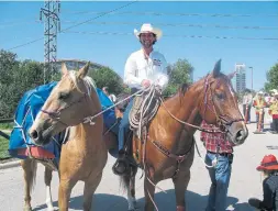  ?? BILL GRAVELAND THE CANADIAN PRESS FILE PHOTO ?? Filipe Masetti Leite rides out of the Stampede grounds in Calgary on July 8, 2012, to begin his epic journey across 12 nations and more than 25,000 kilometres.