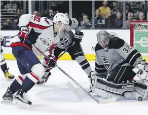  ?? RYAN KANG/THE ASSOCIATED PRESS ?? Los Angeles Kings goaltender Jonathan Quick blocks a shot from Washington Capitals centre Evgeny Kuznetsov on Saturday in Los Angeles. The 4-2 loss was Washington’s third in a row, and was quickly followed by a 5-2 defeat to the Anaheim Ducks.