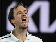  ?? The Associated Press ?? Russia’s Daniil Medvedev reacts after winning a point against Greece’s Stefanos Tsitsipas Friday during their semifinal match at the Australian Open in Melbourne, Australia.