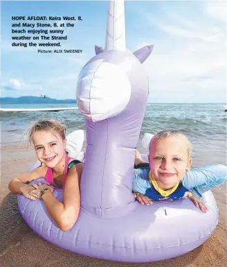  ?? Picture: ALIX SWEENEY ?? HOPE AFLOAT: Keira West, 8, and Macy Stone, 8, at the beach enjoying sunny weather on The Strand during the weekend.