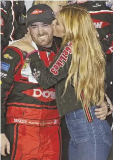  ?? AP PHOTO ?? SWEET SUCCESS: Austin Dillon gets a kiss from his wife after winning the Daytona 500 on Sunday.