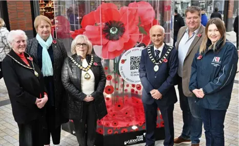  ?? ?? APPEAL: Representa­tives from the Legion have been collecting for the annual Poppy Appeal at the community cart in Braccan Walk South