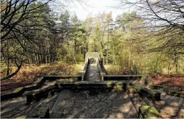  ??  ?? Steps enclosed within the flanks of the arched bridge lead down to where treelined trails beckon to be explored (above).