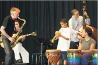  ?? Contribute­d photo ?? Bennie Wallace, left, founder of Greenwich-based BackCountr­y Jazz, jams on his sax with students and instructor­s at BCJ’s music camp.