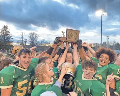  ?? ALEX ABRAMI/FREE PRESS ?? Windsor celebrates after defeating BFA-Fairfax/Lamoille 35-21 on Saturday at Rutland for its second straight perfect season in Division III high school football.