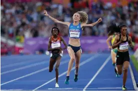  ?? Games. Photograph: Tom Jenkins/The Guardian ?? Eilish McColgan celebrates winning gold for Scotland, ahead of Kenya’s Irene Cheptai (left), in the 10,000m at the Commonweal­th