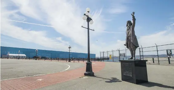  ?? DARREN STONE, TIMES COLONIST ?? The Town Cryer statue beckons at an eerily empty Ogden Point terminal. A record 300 cruise ships were scheduled to call this season, bringing 770,000 passengers.