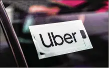  ?? JEENAH MOON/THE NEW YORK TIMES ?? Uber set two dubious quarterly records Thursday as it reported its largest-ever loss, exceeding $5 billion, and its slowest revenue growth.