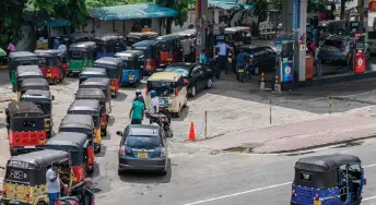  ?? — AFP file photo ?? Motorists queuing up to buy fuel at a Ceylon Petroleum Corporatio­n fuel station in Colombo. Bankrupt Sri Lanka is seeking debt moratorium on foreign debt repayments until 2028.