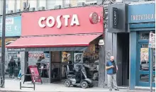  ?? NISHAT AHMED THE ASSOCIATED PRESS ?? Coca-Cola said Friday it will buy the Britain's biggest coffee company, Costa, from Whitbread for US$5.1 billion in cash.