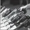  ?? JOHN LOCHER / AP FILE (2016) ?? Handguns are displayed in January 2016 at a trade show in Las Vegas.