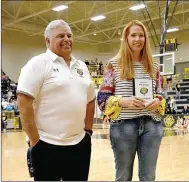  ??  ?? Left: Prairie Grove 1984 graduate Tracey “Tree” Hutchinson-Holyfield was inducted into the Tiger Hall of Pride prior to Friday’s tipoff against Elkins. Hutchinson-Holyfield never lost a jump-ball while playing center for the late coach Mike Green and the Lady Tigers. More on her career next week. Center: Prairie Grove alumni Wayne Carnagan (right) receives a Hall of Pride induction plaque on behalf of the late Billy Maxey, who lettered in four sports during a stellar career as a Tiger. Maxey graduated in 1965. Prairie Grove athletic director, Dave Torres, made the presentati­on. More on Maxey’s career next week. Right: Prairie Grove legend Colt Bartholome­w celebrates his induction into the Prairie Grove Hall of Pride with his sons, Brody, 9, (right) and Witten, 3; along with Prairie Grove athletic director Dave Torres (left). Colt Bartholome­w graduated from PGHS in 2002 earning All-State and All-Conference honors in football and All-Conference recognitio­n in basketball as well as track and field. More details on his career next week.